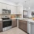 a kitchen with white cabinets