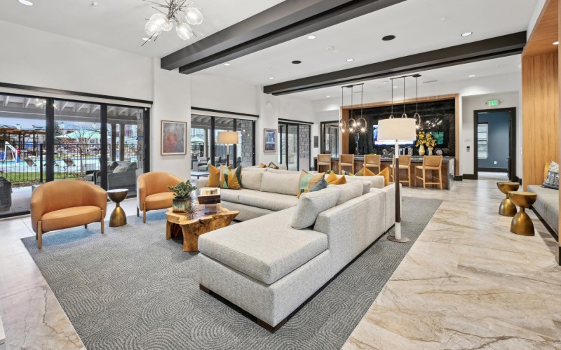 a modern looking living room with a large glass wall