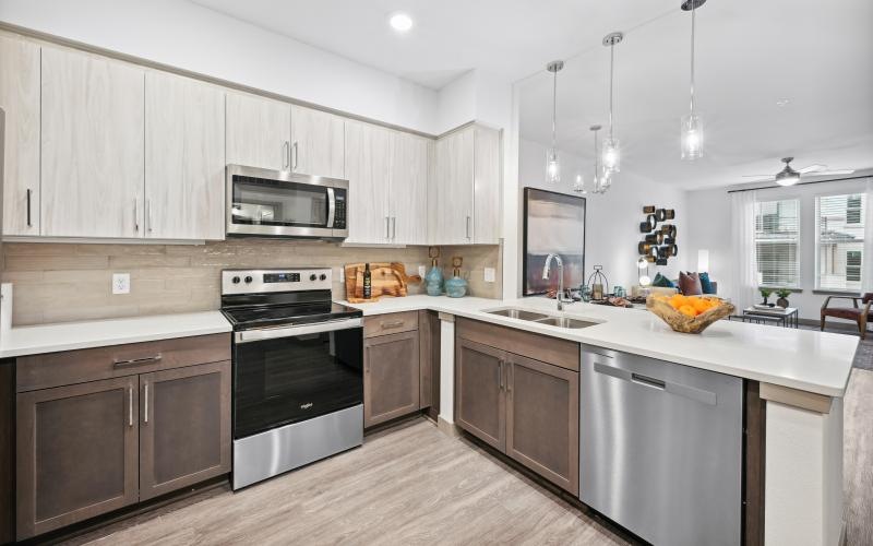 a kitchen with white cabinets